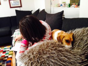 Pip reading with her dog.